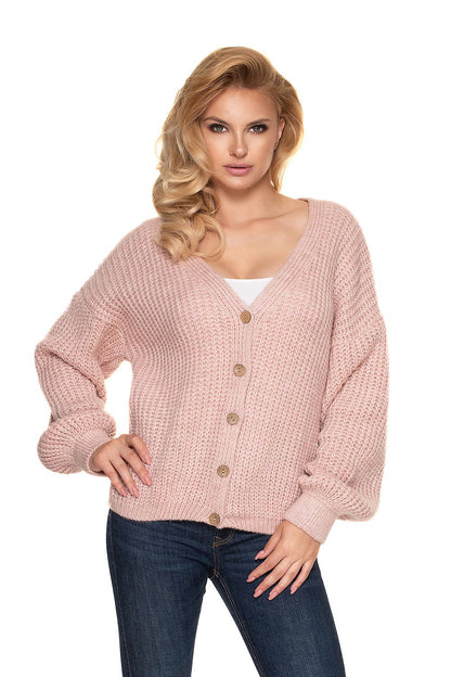 PeeKaBoo Oversized Cardigan Sweater with Wooden Buttons, Cozy Knit, Elegant Style - Model posing in a soft pink oversized cardigan sweater with wooden buttons, paired with fitted jeans.
