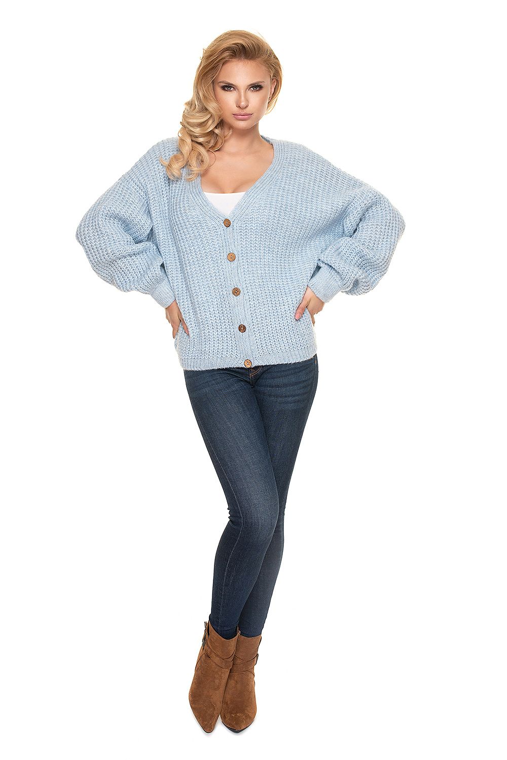 Chic front view of the PeeKaBoo Oversized Cardigan Sweater with Wooden Buttons, highlighting its voluminous sleeves and luxurious knit style, paired with stylish denim.