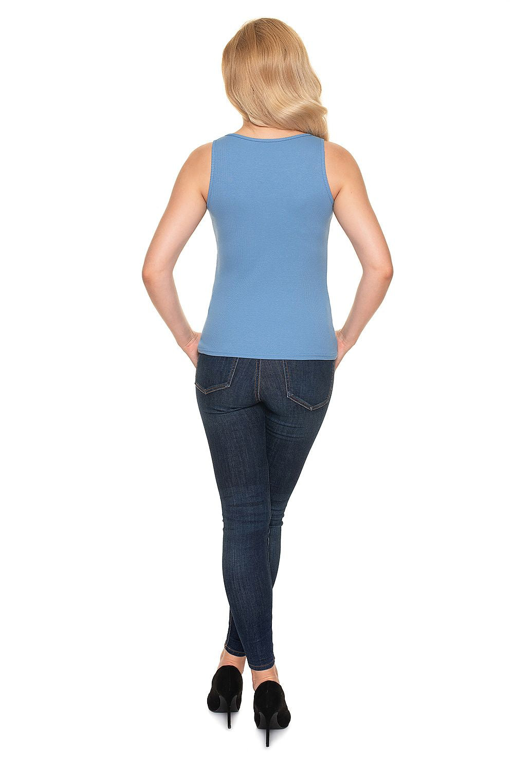 Back view of a model wearing a luxury fitted blouse with heart neckline in high-quality ribbed cotton by PeeKaBoo, complemented with dark jeans.