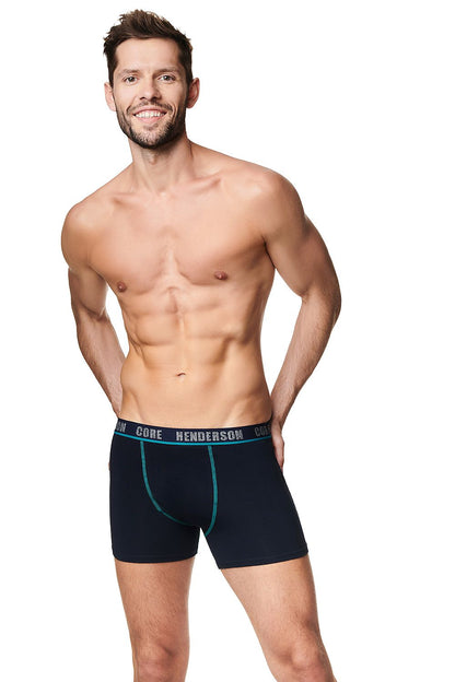 Luxury Men's 2-Pack Henderson Boxer Shorts in Black - Soft Cotton with Stylish Contrasting Piping, model showcasing the comfortable fit and premium design.