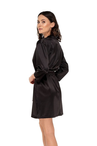 Back view of the elegant black satin bathrobe by Babella, highlighting the luxurious design and 7/8 sleeves on a model.