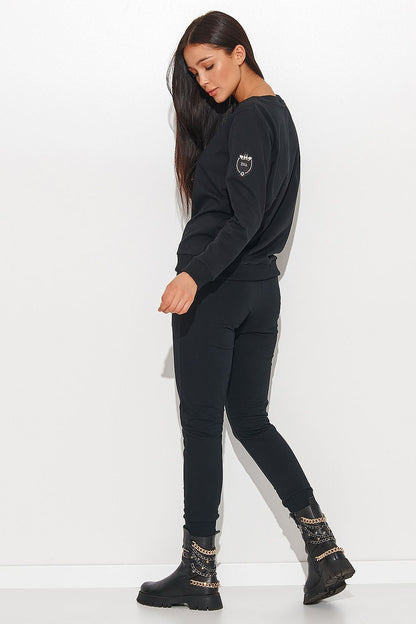 Elegant Numinou Two-Piece Cotton Knit Women's Set with Pocketed Pants - A stylish black women's set featuring a comfortable long-sleeved top and fitted pants, ideal for both business and casual wear.