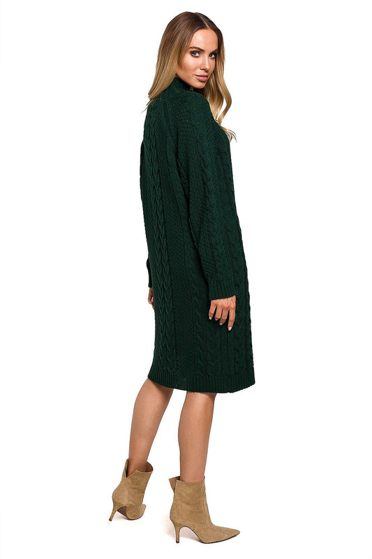 Elegant Knee-Length Turtleneck Dress with Gold Buttons by Moe, featuring a stylish model from behind in the luxurious green cable-knit dress, highlighting the sophisticated design.