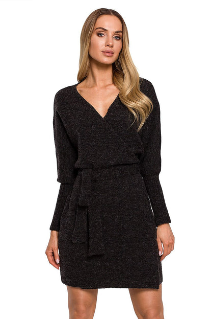 Elegant Moe Sweater Dress with Side Ties, Wide Sleeves, and Deep Overlap Neckline displayed by a model, featuring a flattering silhouette and luxurious knit fabric.