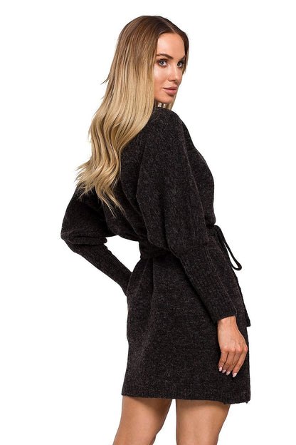 Elegant Moe Sweater Dress with Side Ties, Wide Sleeves, and Deep Overlap Neckline viewed from the back, demonstrating its elegant design and comfort.