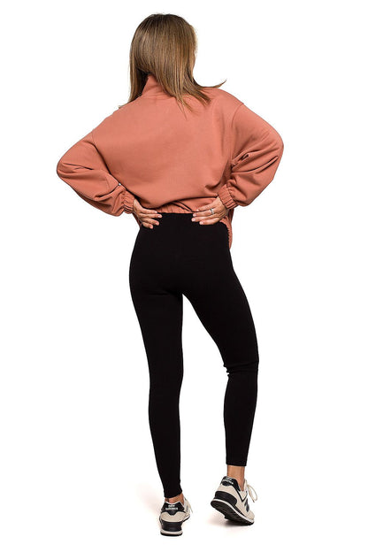 Luxurious BeWear Striped Leggings showcased on a model wearing a soft peach-coloured sweatshirt, offering a stylish and comfortable look.