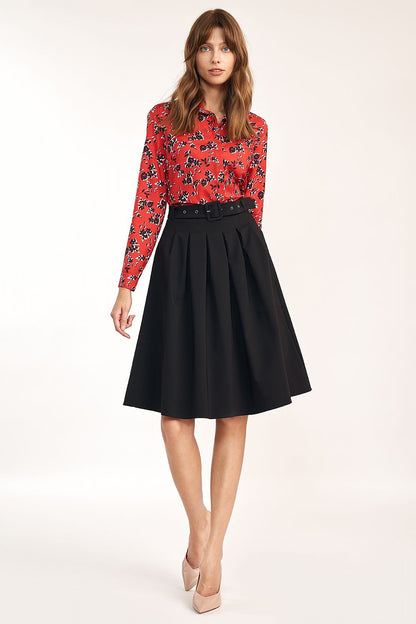 Elegant A-Line Skirt With Belt and Pleats For Office & Casual Occasions By Nife, captured on a model wearing a vibrant red floral shirt that complements the refined black skirt.