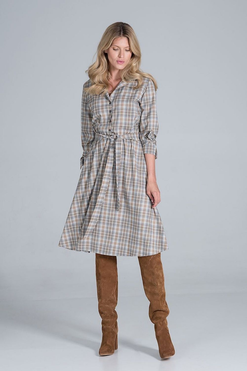 Elegant Midi Dress by Figl featuring a jacket-style v-neck, flared hem, and tie belt, modelled elegantly with knee-high brown boots.