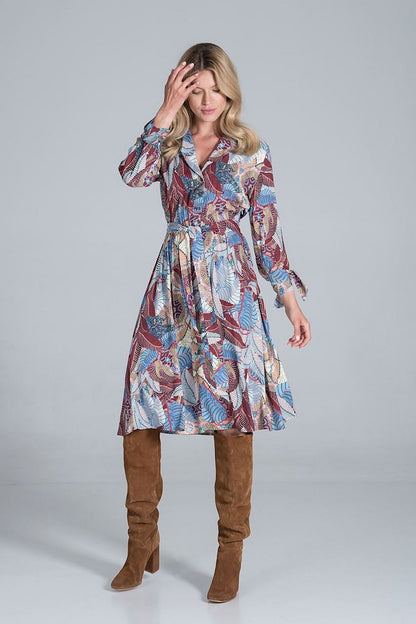Elegant Midi Dress by Figl with Jacket-Style V-Neck, Flared Hem & Tie Belt, showcased in an eye-catching colourful design, worn by a model styled with knee-high brown boots.