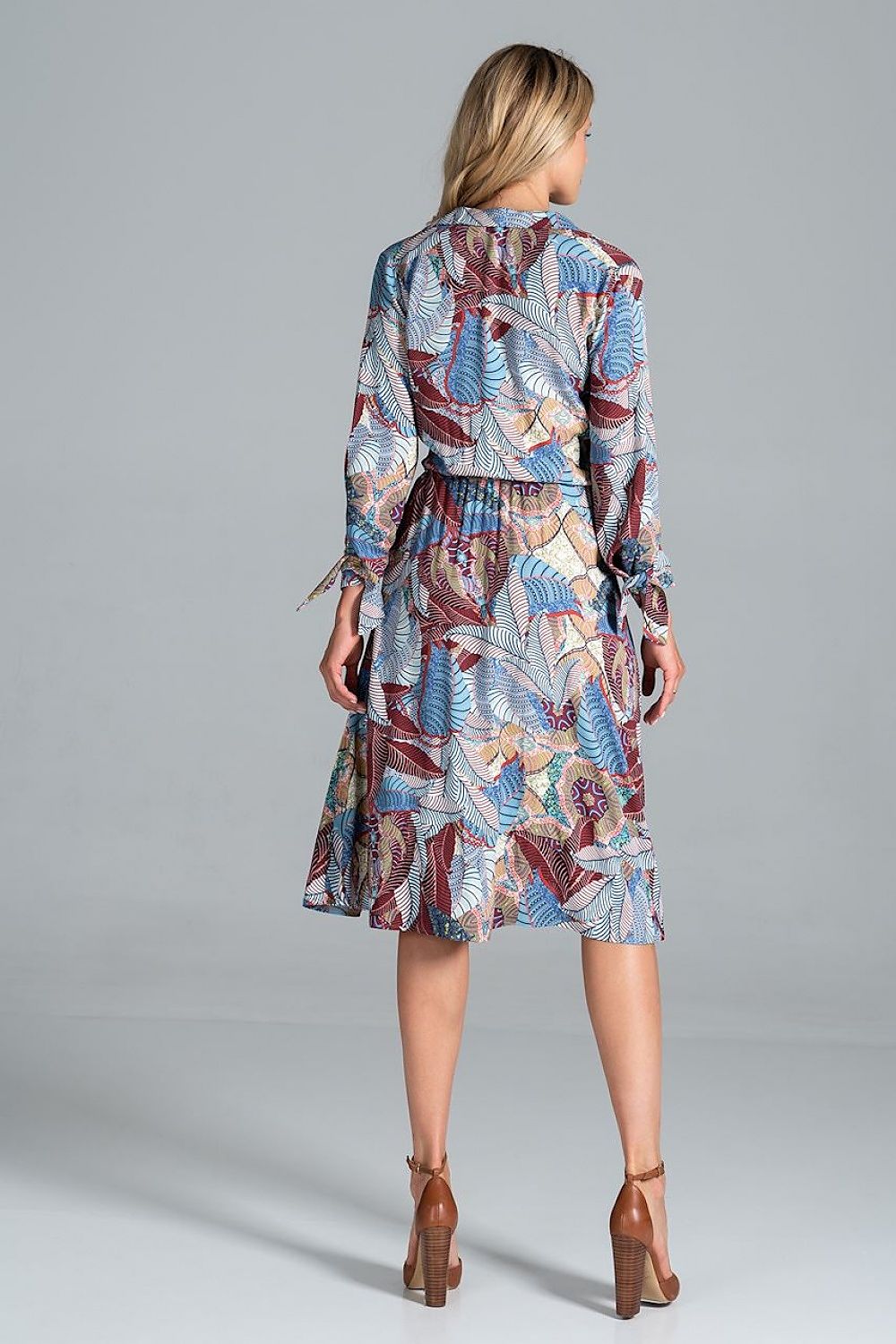 Back view of the Elegant Midi Dress by Figl with Jacket-Style V-Neck, Flared Hem & Tie Belt, displaying its unique pattern and flared hem on a model.