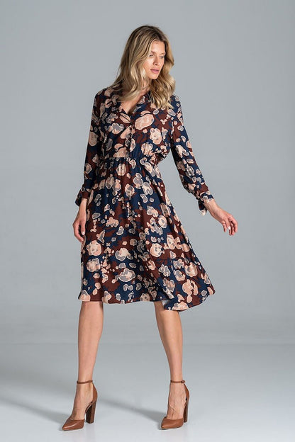 Elegant Midi Dress by Figl, featuring a floral pattern, jacket-style v-neck, and flared hem, model displayed gracefully with chic high-heeled shoes.