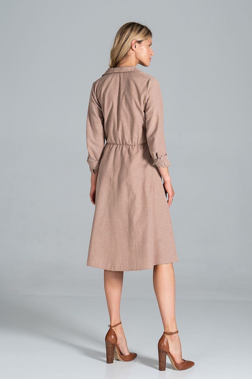 Elegant Midi Dress by Figl showcased from the back, emphasising its chic jacket-style v-neck, flared elegance and comfortable tie belt, along with trendy high-heeled boots.