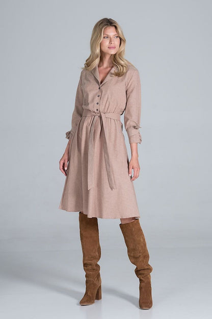 Elegant Midi Dress by Figl in a fashionable pose, featuring a polished jacket-style v-neck, flared hem and tie belt, elegantly paired with knee-high suede boots.