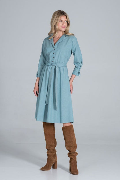 Elegant Midi Dress by Figl with Jacket-Style V-Neck, Flared Hem & Tie Belt, displayed on a model in a stunning pose, showcasing the sophisticated ensemble with stylish knee-high boots.