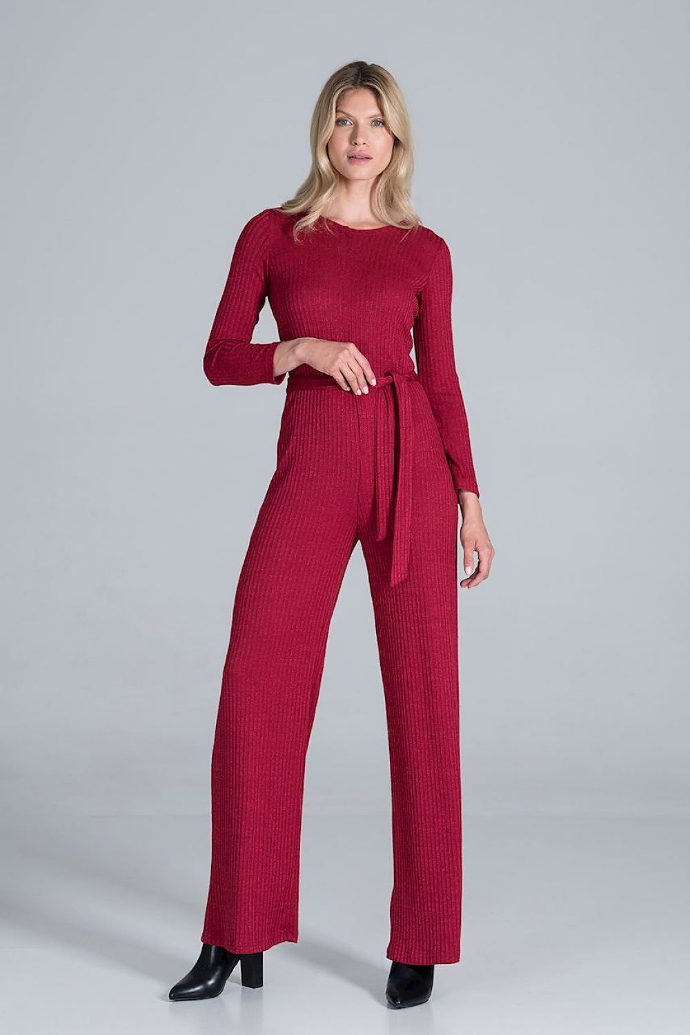 Elegant Figl Wide-Legged Jumpsuit with Back Slit in Flowing Ribbed Knit, featuring a close-up of the model in a stylish burgundy jumpsuit, highlighting the exquisite ribbed texture and elegant silhouette.