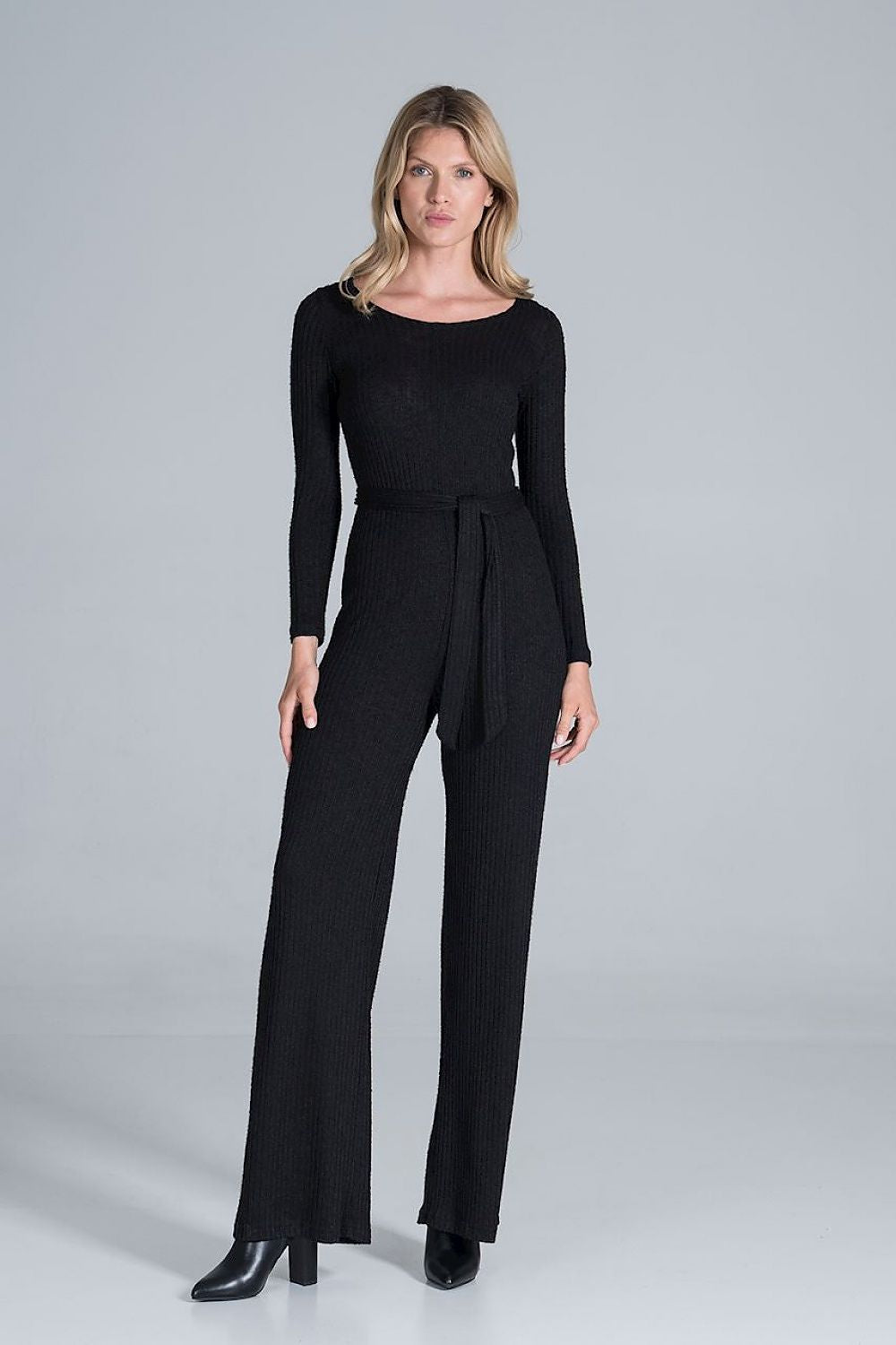 Elegant Figl Wide-Legged Jumpsuit with Back Slit in Flowing Ribbed Knit, presented in classic black, designed with long sleeves and a chic belt, embodying timeless elegance.