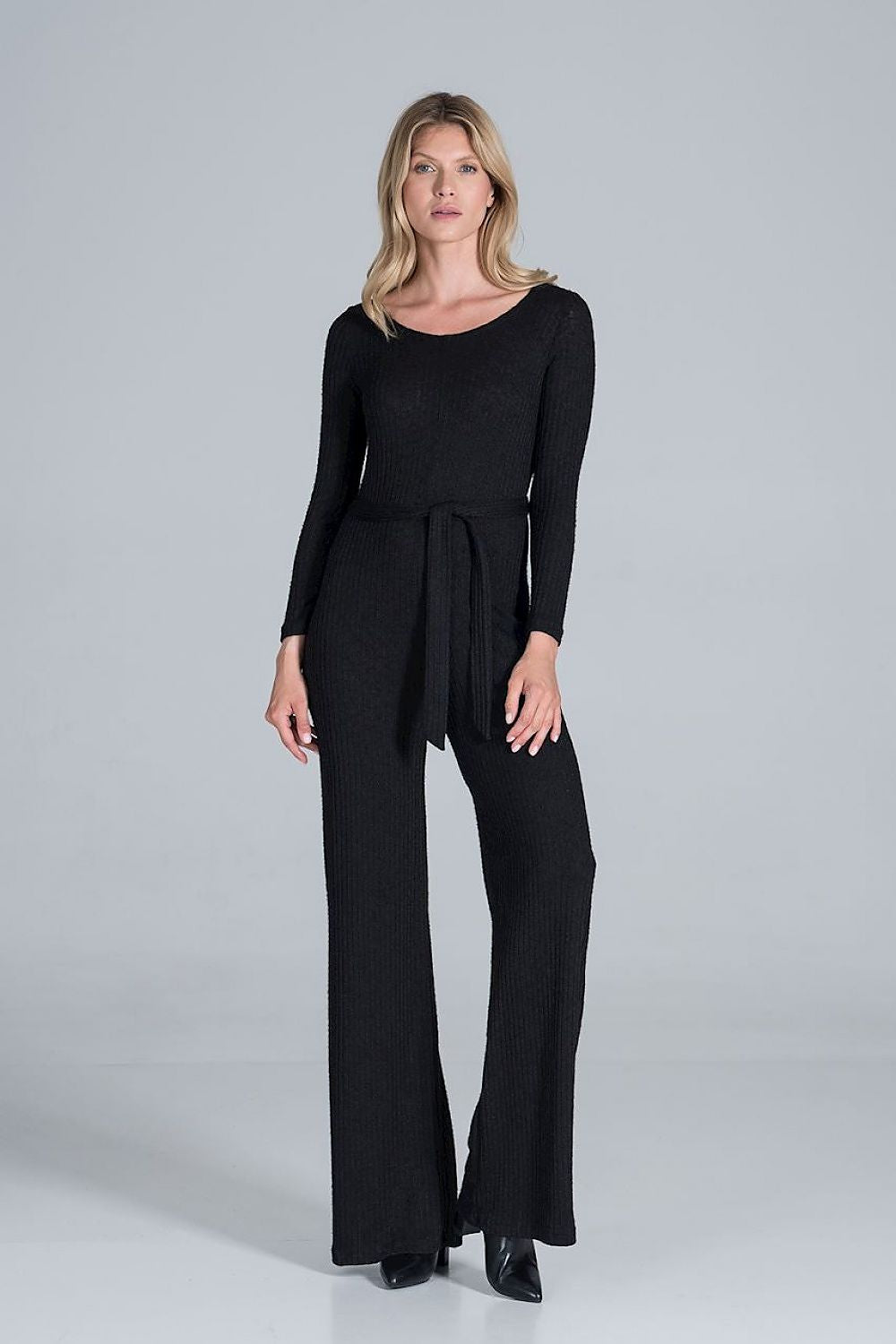 Elegant Figl Wide-Legged Jumpsuit with Back Slit in Flowing Ribbed Knit, elegantly styled in black, featuring long sleeve design and a flattering waist tie, perfect for upscale occasions.