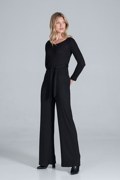 Elegant Figl Wide-Legged Jumpsuit with Back Slit in Flowing Ribbed Knit, captured in black, with a long-sleeve silhouette and elegant waist tie, exuding a sense of refined luxury.