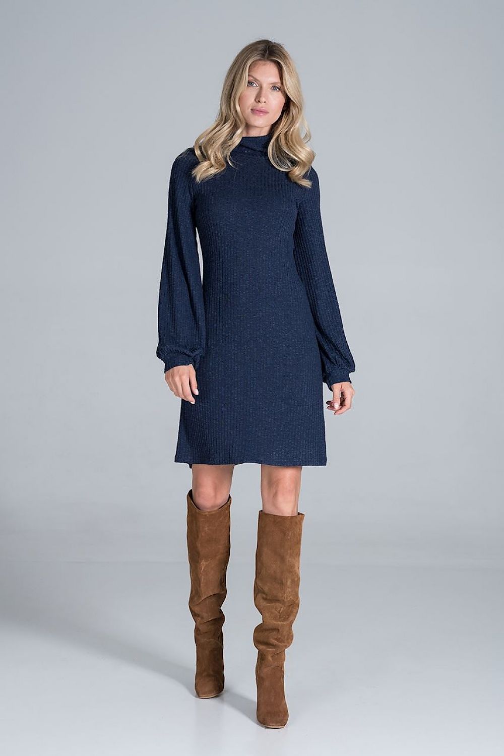 Full-body front view of the Elegant Turtleneck Midi Dress in Flowing Ribbed Knit by Figl in navy blue, paired with chic knee-high brown footwear.