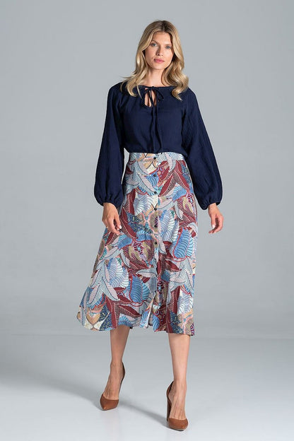 Elegant Figl Trapeze Midi Skirt With Front Buttons showcased with a chic navy blouse, highlighting the vibrant floral design in hues of blue and red, perfect for sophisticated occasions.