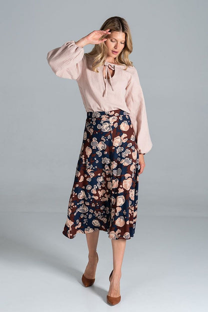 Luxurious Figl Trapeze Midi Skirt With Front Buttons elegantly styled with a light pink blouse, showcasing a rich floral design in dark tones, perfect for high-end fashion settings.