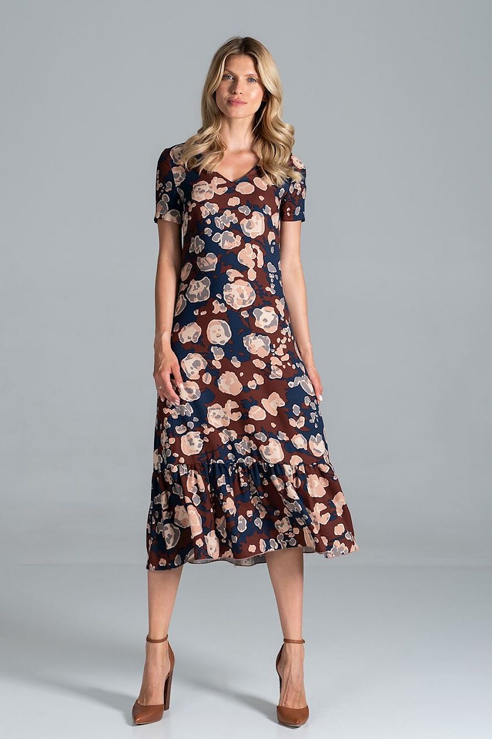Elegant Midi Dress with Sweetheart Neckline and Flouncy Hem by Figl, highlighted in a floral pattern, modelled by a woman with a charming expression, embodying youthful grace.