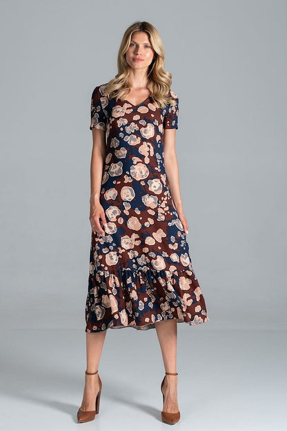 Elegant Midi Dress with Sweetheart Neckline and Flouncy Hem by Figl, highlighted in a floral pattern, modelled by a woman with a charming expression, embodying youthful grace.