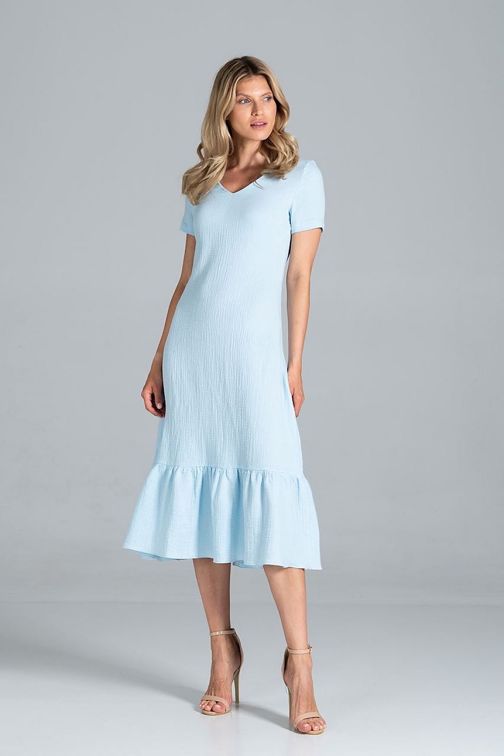 Elegant Midi Dress with Sweetheart Neckline and Flouncy Hem by Figl, displayed in a serene pastel light blue colour, modelled by a woman exuding elegance and sophistication.