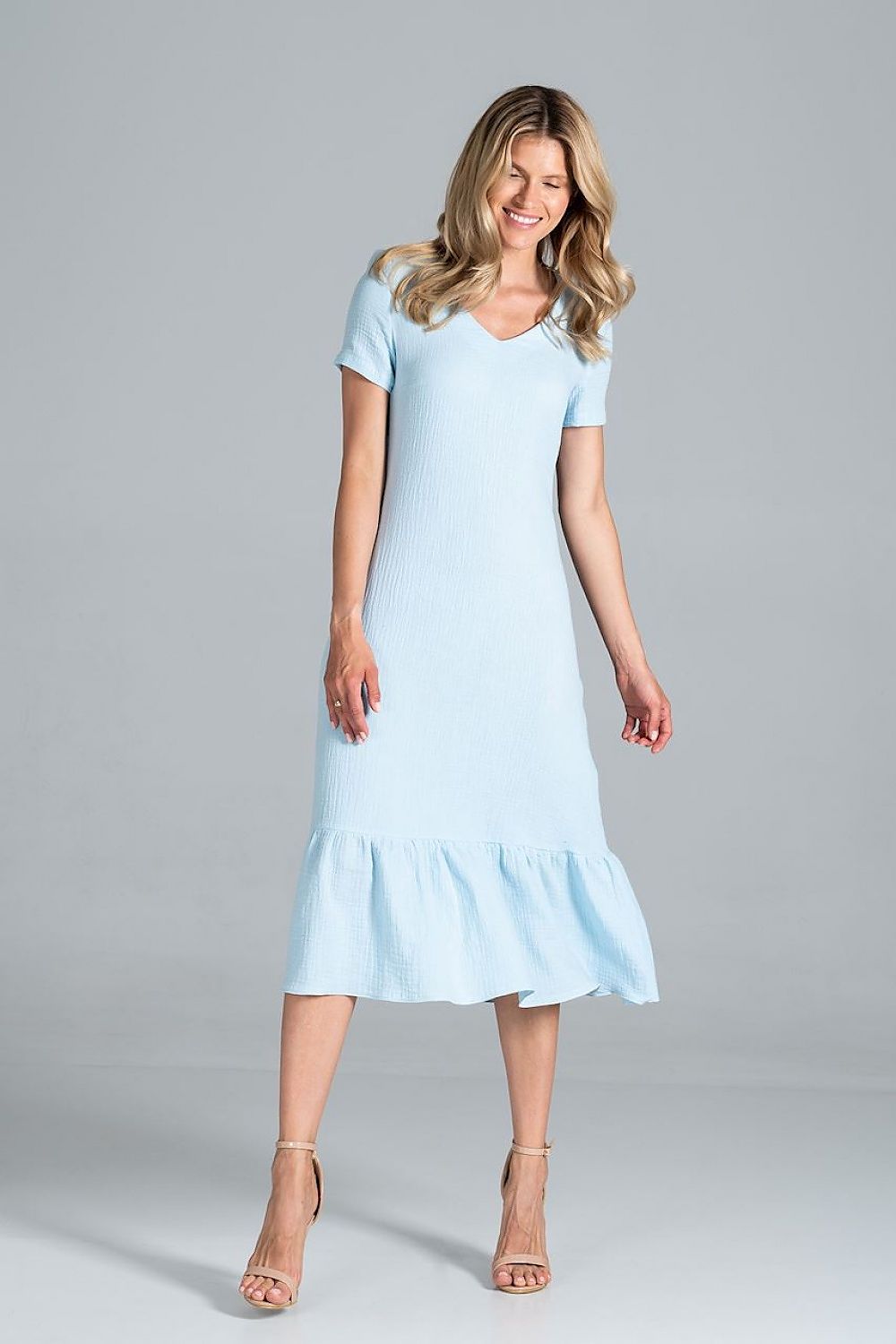 Elegant Midi Dress with Sweetheart Neckline and Flouncy Hem by Figl, presented in a charming light blue colour, accentuating the model's joyful expression.