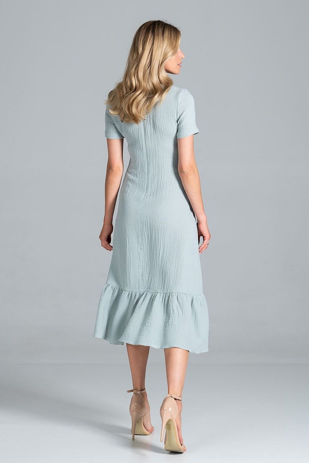 Back view of the Elegant Midi Dress with Sweetheart Neckline and Flouncy Hem by Figl in a soft mint colour, showcasing its flouncy hem and graceful silhouette.