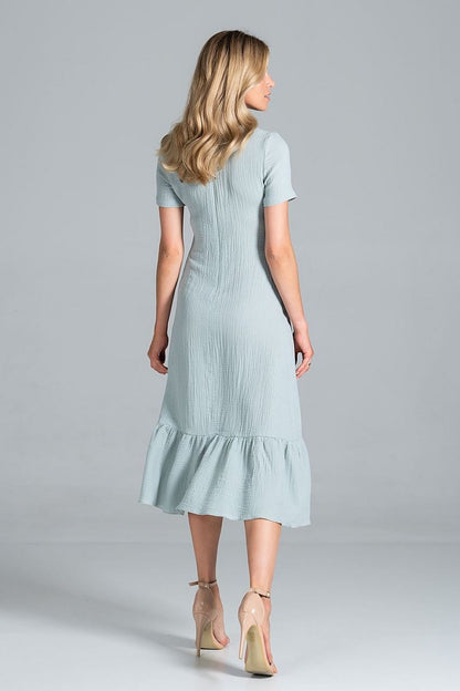 Back view of the Elegant Midi Dress with Sweetheart Neckline and Flouncy Hem by Figl in a soft mint colour, showcasing its flouncy hem and graceful silhouette.