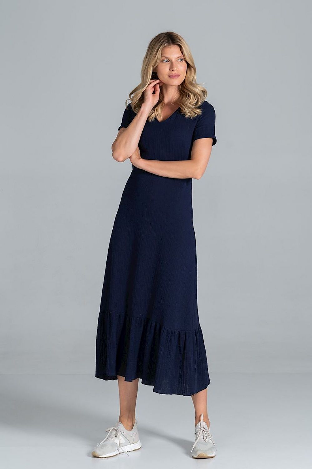Elegant Midi Dress with Sweetheart Neckline and Flouncy Hem by Figl displayed on a model in navy, demonstrating its sophisticated design with a flouncy hem and sweetheart neckline.