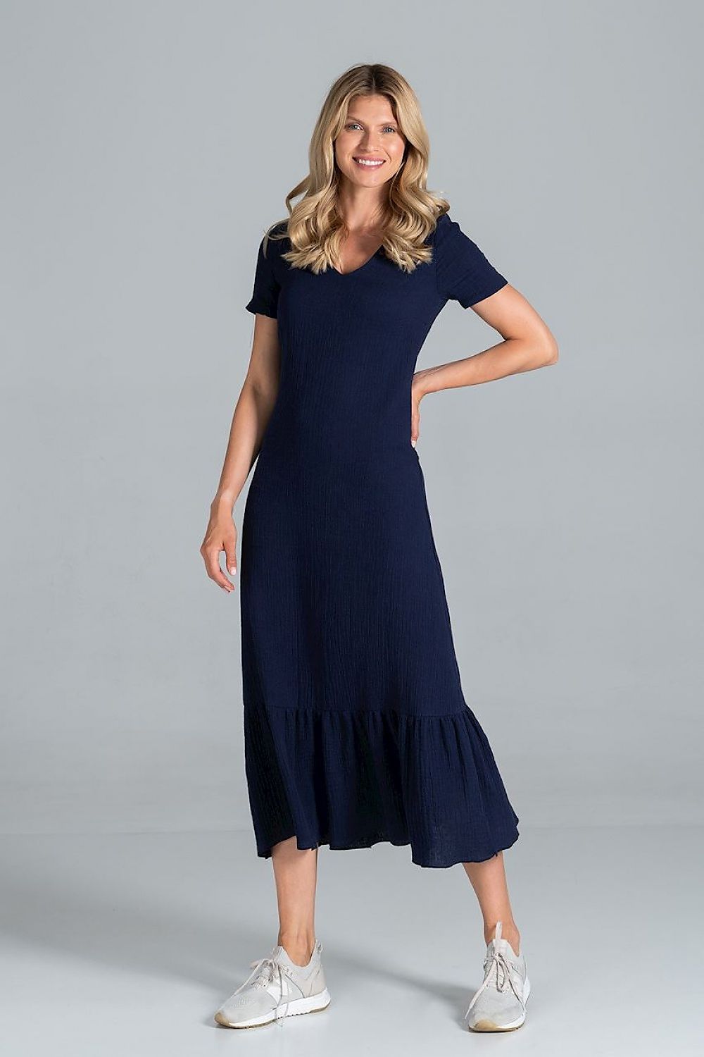 Elegant Midi Dress with Sweetheart Neckline and Flouncy Hem by Figl presented on a model in navy, capturing the graceful movement and elegant design.