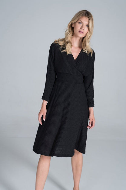 Stunning Elegant Midi Dress with Envelope Neckline, Kimono Sleeves & Wide Waistband by Figl, showcased on a model in a minimalist setting, highlighting its flowing ribbed knitwear and flattering silhouette.