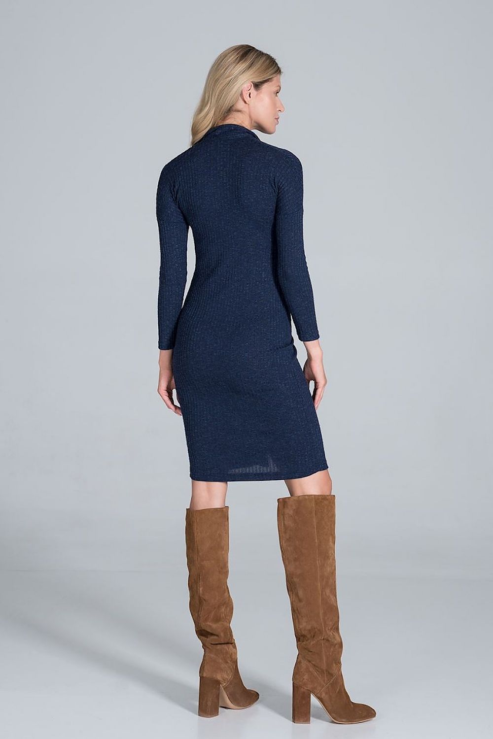 Back view of a model in a luxurious elegant midi dress with collar, pleated front & long sleeves by Figl Fashion, accentuated with trendy brown thigh-high boots.
