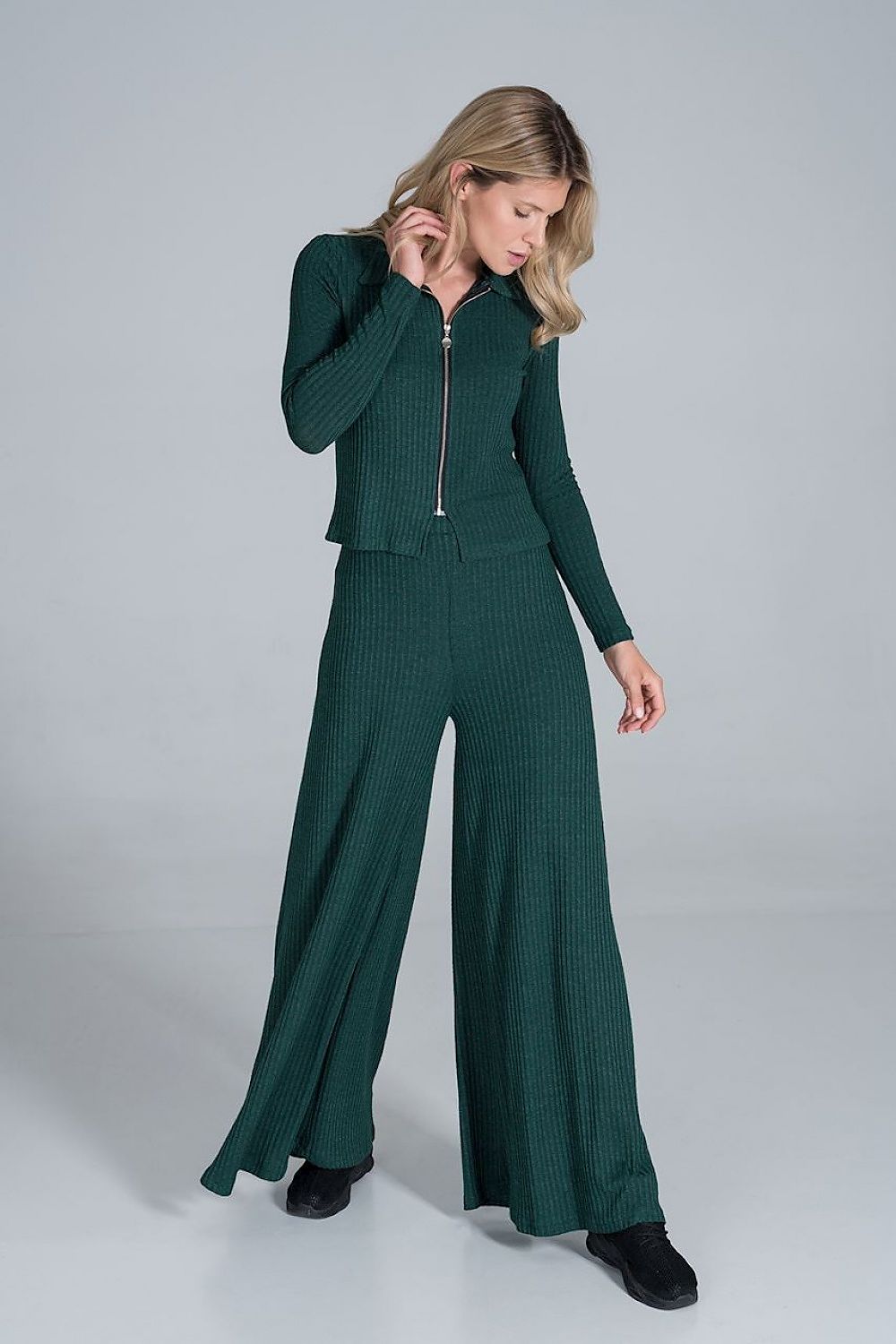 Figl Women's Luxury Ribbed Knit Blouse With Collar and Front Zip Fastening, Long Sleeves - Model presenting a stylish look with the dark green ribbed blouse and wide-leg trousers, highlighting the elegant design.