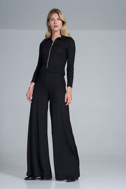 Close-up of Figl Women's Luxury Ribbed Knit Blouse With Collar and Front Zip Fastening, Long Sleeves, featuring a modern look complemented by stylish wide pants in a rich black shade.