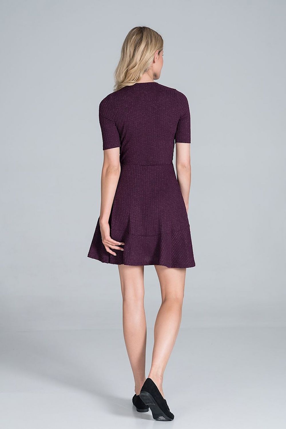 Elegant Figl Mini Daydress in Flowy Ribbed Knit showcasing a stylish envelope neckline and flounce detail, viewed from the back.