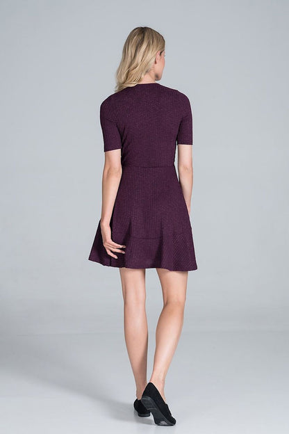 Elegant Figl Mini Daydress in Flowy Ribbed Knit showcasing a stylish envelope neckline and flounce detail, viewed from the back.