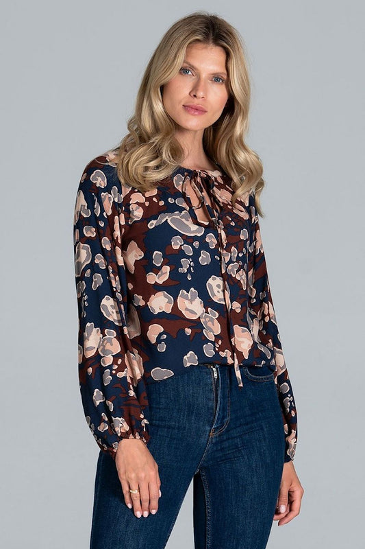 Stylish model showcasing the Luxury Figl Blouse with Half-Round Neckline, Long Sleeves & Elastic Band, featuring a vibrant floral pattern, perfect for a chic modern look.