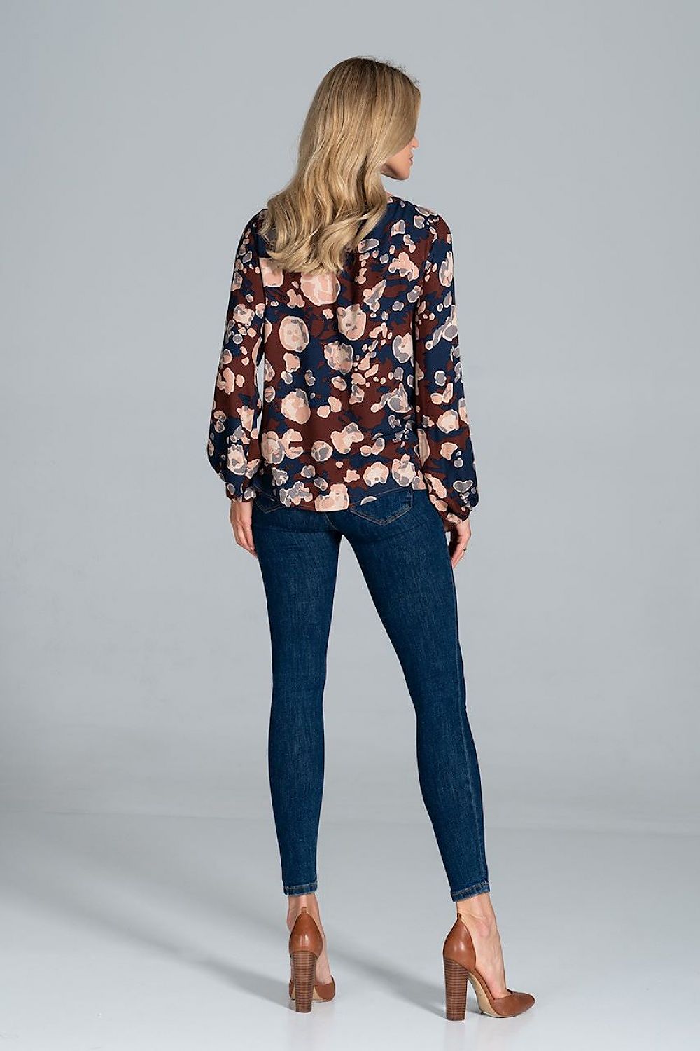 Back view of the Luxury Figl Blouse with Half-Round Neckline, Long Sleeves & Elastic Band, highlighting the flowing sleeves and trendy floral pattern, ideal for a stylish ensemble.