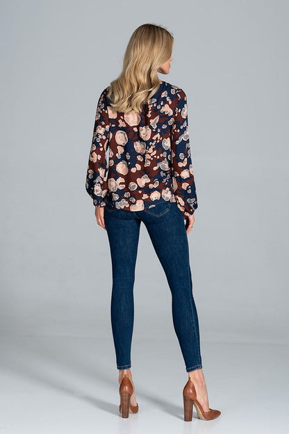Back view of the Luxury Figl Blouse with Half-Round Neckline, Long Sleeves & Elastic Band, highlighting the flowing sleeves and trendy floral pattern, ideal for a stylish ensemble.