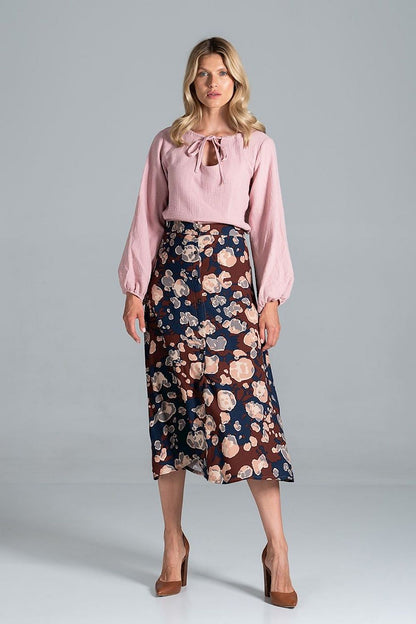 Elegant front view of the Luxury Figl Blouse with half-round neckline, complemented by a floral patterned skirt for a refined appearance.