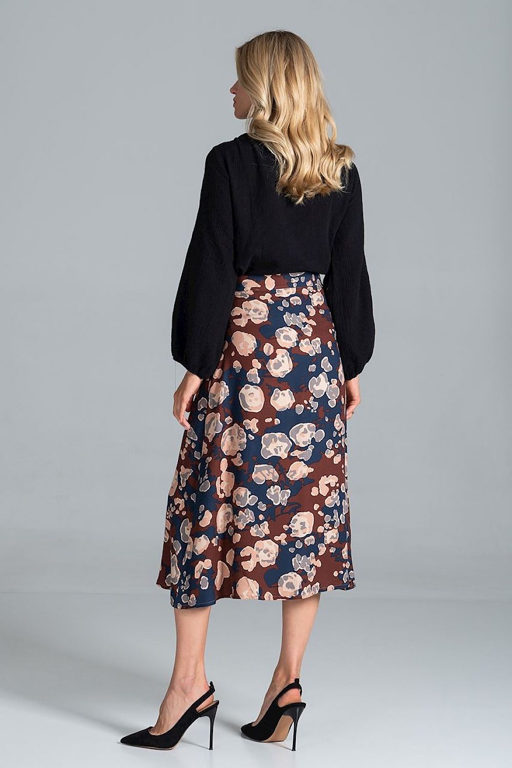 Elegant view of a Luxury Figl Blouse with Half-Round Neckline, Long Sleeves & Elastic Band, 100% Viscose, styled with a floral skirt, showcasing a sophisticated back view.