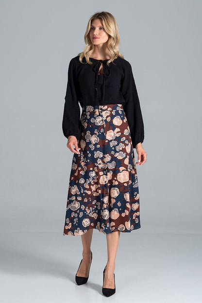 Chic front view of a Luxury Figl Blouse with Half-Round Neckline, Long Sleeves & Elastic Band, 100% Viscose, elegantly paired with a floral skirt for a refined look.