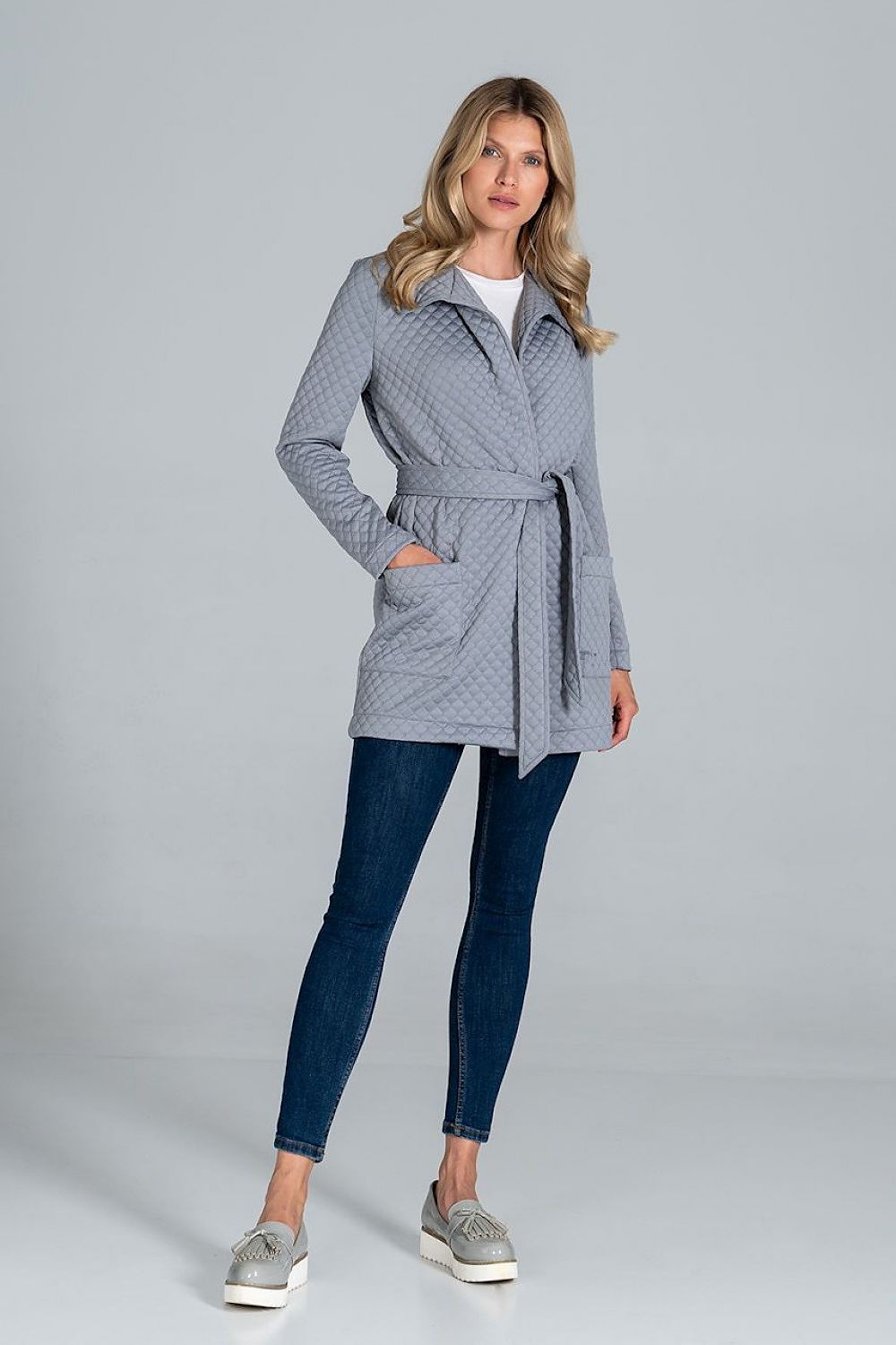 Model elegantly presenting the Figl Short Quilted Coat With Belt And Collar, accentuating its luxury fabric and stylish belt, creating a chic ensemble.