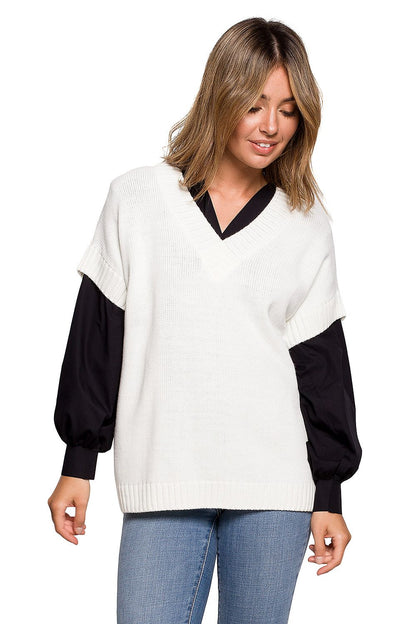 Elegant BE Knit Sleeveless Knitwear Gilet for Stylish Business and Casual Outfits, worn by a model showcasing a chic look with a white knit top layered over a black shirt and denim jeans.