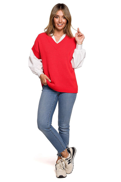 Model striking a pose in the vibrant red Elegant BE Knit Sleeveless Knitwear Gilet, styled with blue jeans.