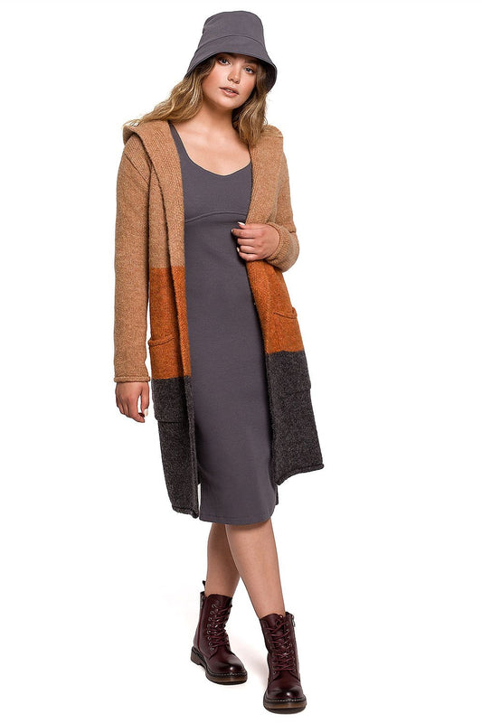 Luxurious Hooded Cardigan by BE Knit, featuring a stylish unbuttoned design in multiple colours. The model showcases the cardigan paired with a fitted outfit and fashionable boots, embodying elegance and comfort.