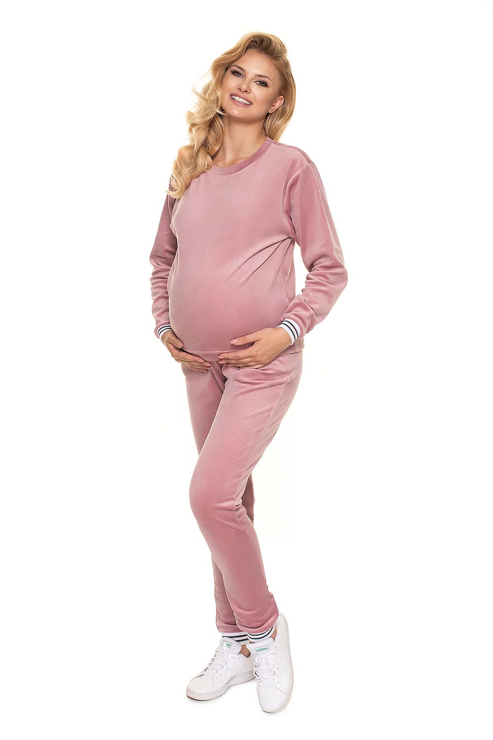 Luxurious PeeKaBoo Velour Tracksuit Set in a soft pink shade, designed for comfort with a pregnant model smiling and showcasing the outfit.